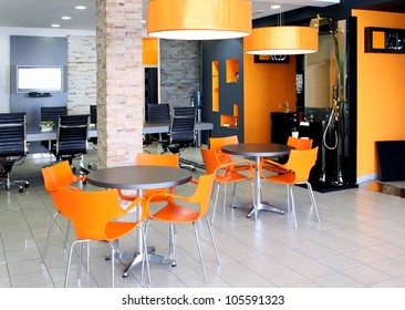 Modern Office Space With Bright Orange Furniture