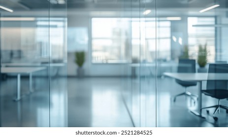 modern office space featuring office interior glass wall, with blurred views of desks and chairs. bright environment is enhanced by natural light streaming through large windows - Powered by Shutterstock