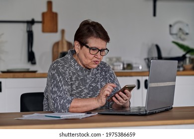 Modern Old Cheerful Lady Using Online Banking. Frustrated Senior Woman Yelling At The Bank Clerk, Dissatisfied With Her Credit Card Balance.