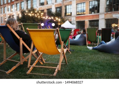 Modern Open Air Cinema With Comfortable Seats In Public Park