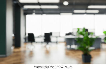 Modern open space business office interior without people with blurred bokeh light background. tables, chairs, computers . copy space. green office concept - Powered by Shutterstock