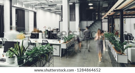 modern open space office interior with blurred business colleagues