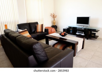 Modern Orange And Brown Interior With Home Entertainment System