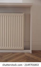 Modern Panel Radiator On White Wall Indoors