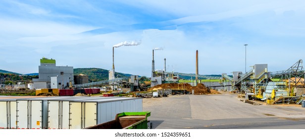 Modern Paper Mill Factory In Maine With Trucks And Railroad In Foreground 