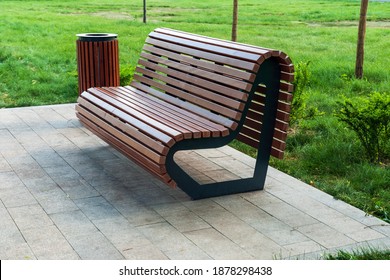 modern park bench and waste bin made of wooden planks