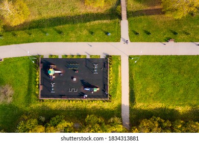 Modern Park Infrastructure: Walking Paths, Children Playing Court, Autumnal Trees. Overhead View