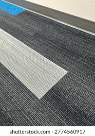 Modern patterned carpet flooring interior showing geometric design and commercial flooring texture detail