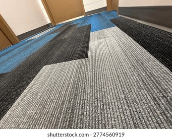 Modern patterned carpet flooring interior showing geometric design and commercial flooring texture detail