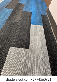 Modern patterned carpet flooring interior showing geometric design and commercial flooring texture detail