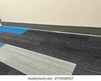 Modern patterned carpet flooring interior showing geometric design and commercial flooring texture detail