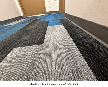 Modern patterned carpet flooring interior showing geometric design and commercial flooring texture detail