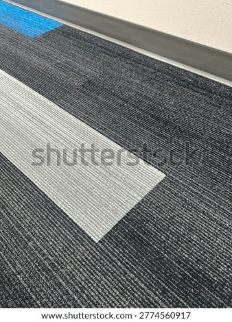 Modern patterned carpet flooring interior showing geometric design and commercial flooring texture detail