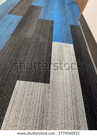 Modern patterned carpet flooring interior showing geometric design and commercial flooring texture detail