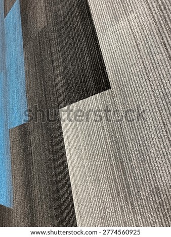 Modern patterned carpet flooring interior showing geometric design and commercial flooring texture detail