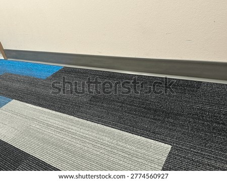 Modern patterned carpet flooring interior showing geometric design and commercial flooring texture detail
