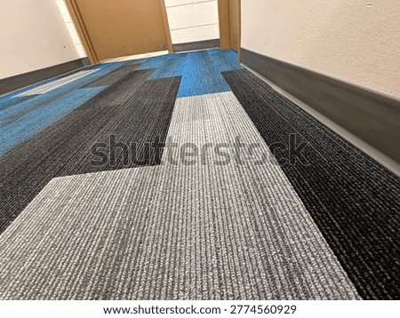 Modern patterned carpet flooring interior showing geometric design and commercial flooring texture detail