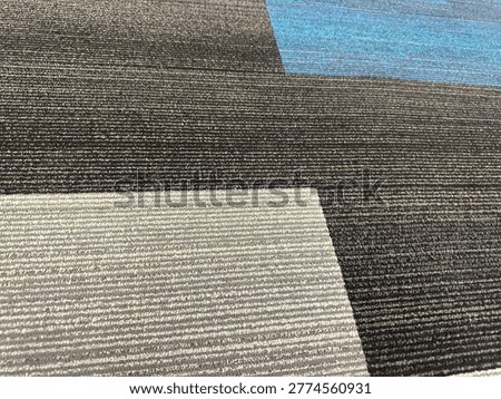Modern patterned carpet flooring interior showing geometric design and commercial flooring texture detail