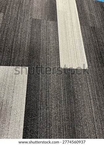 Modern patterned carpet flooring interior showing geometric design and commercial flooring texture detail