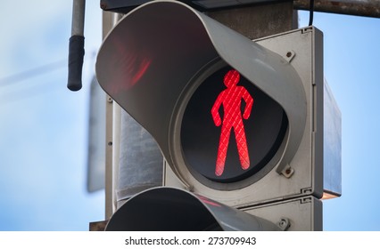 Modern pedestrian traffic lights with red stop signal