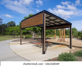 Modern pergola and sitting area with play ground behind in Public Park