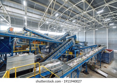 A modern plant for sorting and recycling household waste and waste. Large industrial complex of conveyors, bunkers. - Powered by Shutterstock