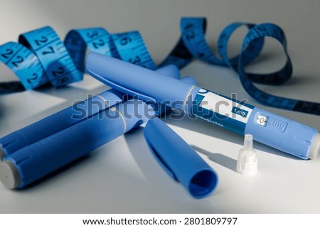 Modern plastic injector devices with tailor measure tool for subcutaneous diabetes care, severe obesity weight loss therapy and healthcare displays.
