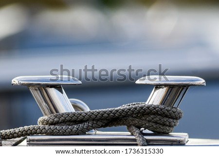 Modern polishing on a yacht with a rope.