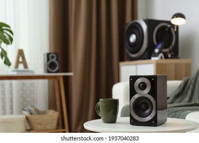 Modern powerful audio speaker system in bright room
