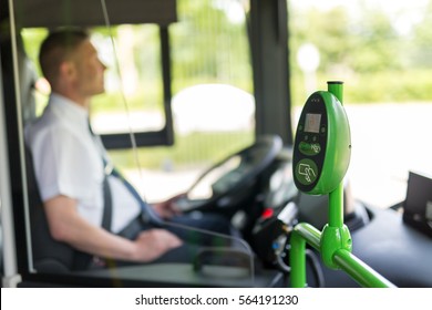 Modern prepaid public transport ticketing system with validation machine at entrance of bus. - Shutterstock ID 564191230