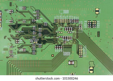 The Modern Printed-circuit Board With Electronic Components Macro Background. Mass Production.  Logos And Trademarks  Removed. There Are Only Standard Positional Notation  And Components Values??.