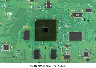 The Modern Printed-circuit Board With Electronic Components Macro Background. Mass Production.  Logos And Trademarks Removed. There Are Only Standard Positional Notation  And Components Values??.