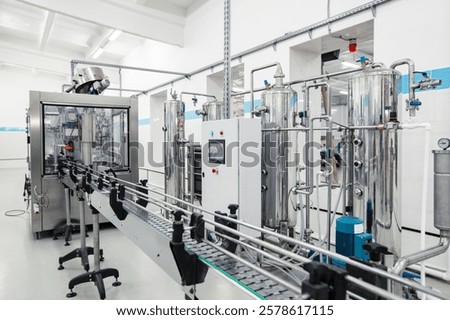 Modern processing line featuring stainless steel machinery in a clean factory environment