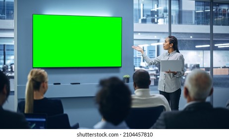 Modern Product Presentation Event: Black Businesswoman Speaks, Uses Green Chroma Key Screen Wall TV. Press Conference For Group Of Diverse Investors, Digital Entrepreneurs, Businesspeople