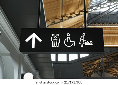 Modern public toilet sign on the wall - Shutterstock ID 2171917883