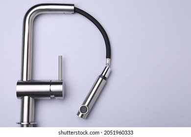 Modern Pull Out Kitchen Faucet On Grey Background, Top View. Space For Text