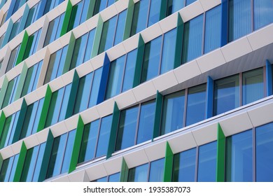 Modern Quadratic Building Detail With Windows Of Blue And Green Colourshades