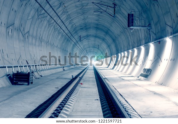 Modern railway tunnel with\
green signal light. Ejpovicke tunely/Ejpovice tunnels. Modern\
technology.