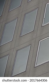 Modern Raw Concrete Office Building With Clean Rectangle Window Array