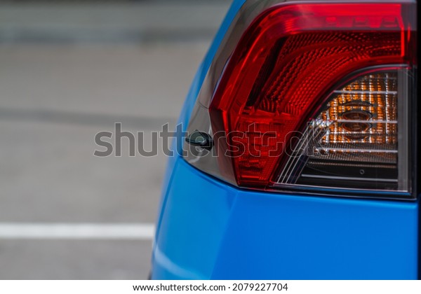 Modern rear light of a\
car. Brake light and arrow of large suv. Rear light of car close up\
view. Tail light.