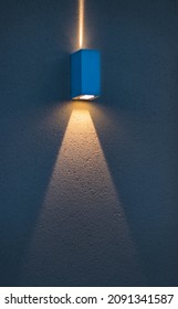 Modern Rectangular Lamp On A Painted Wall.Lamp Illuminates With A Narrow Beam Of Light