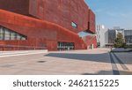 Modern red buildings with library and Learning Center Of Vienna University of Economics and Business (Wirtschaftsuniversitat Wien) is the largest Business University in Europe. Blue sky at sunny day