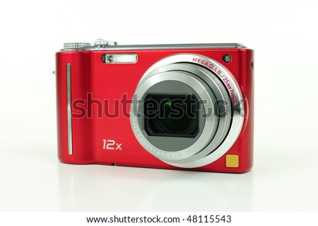 Modern red compact high zoom digital camera over white