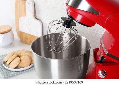 Modern Red Stand Mixer And Cookies On White Table, Closeup