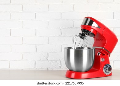 Modern Red Stand Mixer On White Wooden Table, Space For Text