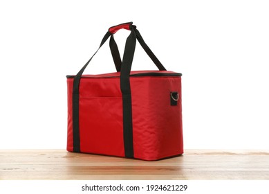 Modern Red Thermo Bag On Wooden Table Against White Background