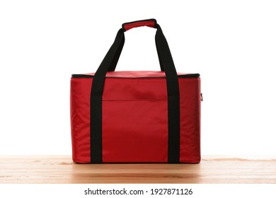 Modern Red Thermo Bag On Wooden Table Against White Background