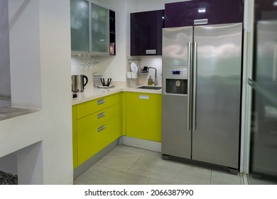 Modern refrigerator  stainless steel doors, Fridge side by side  full of fresh food copy space isolated in kitchen.