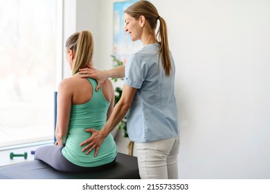 A Modern rehabilitation physiotherapy woman worker with woman client - Powered by Shutterstock