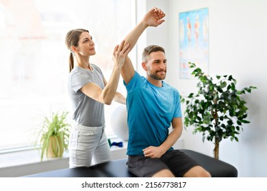 A Modern rehabilitation physiotherapy woman worker with man client - Shutterstock ID 2156773817